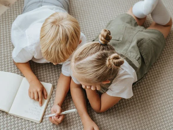 kids reading, laying down on berber carpet